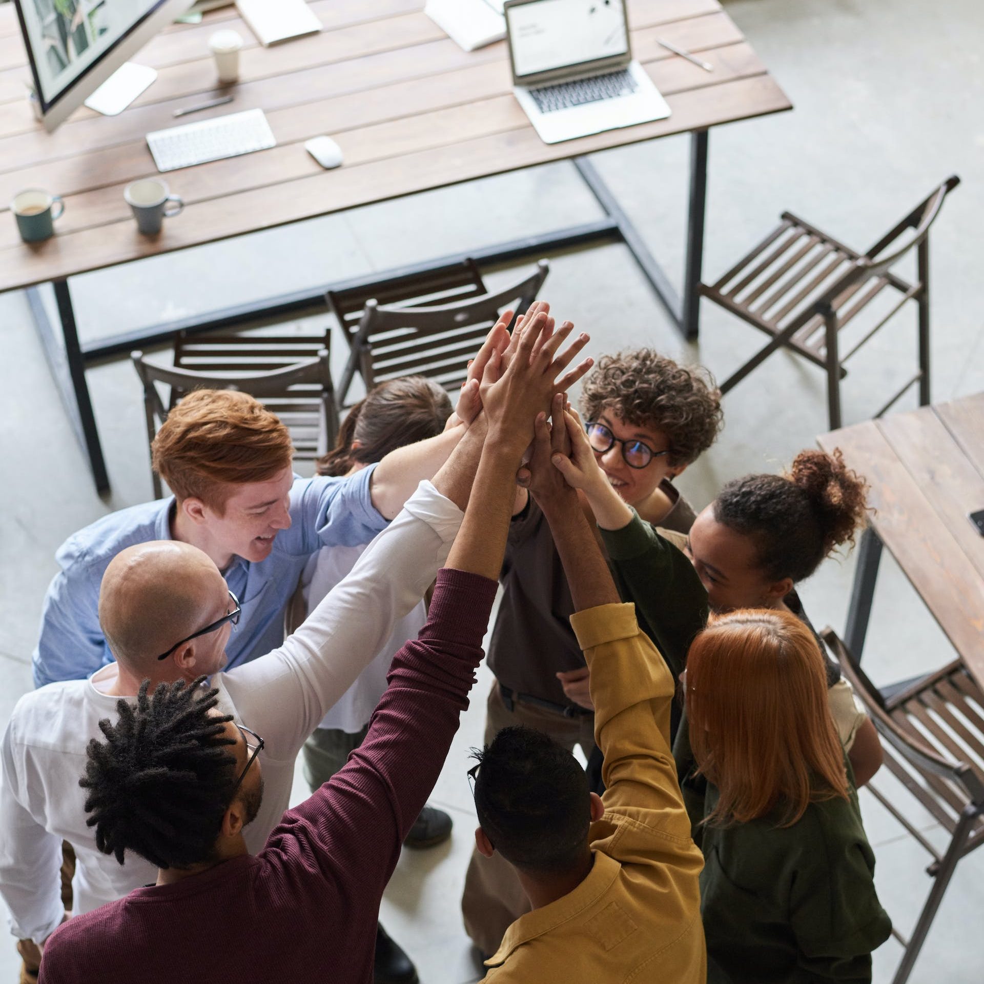 Photo Of People Holding Each Other's Hands